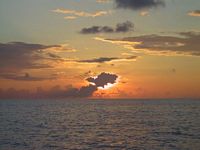 Sunrise behind stormclouds